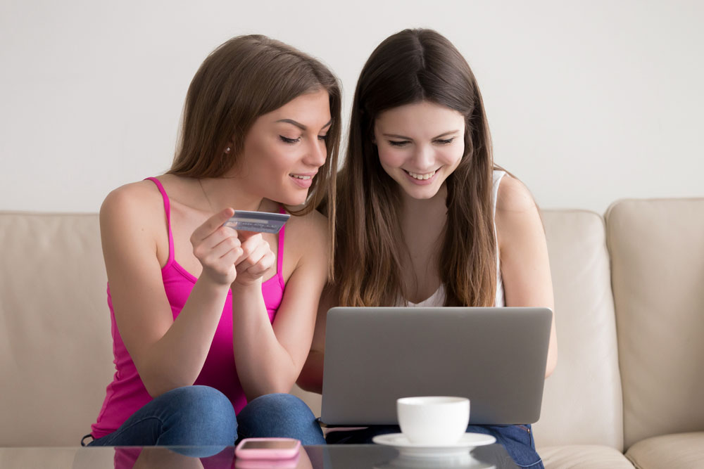 two-happy-girlfriend-ordering-goods-internet.jpg